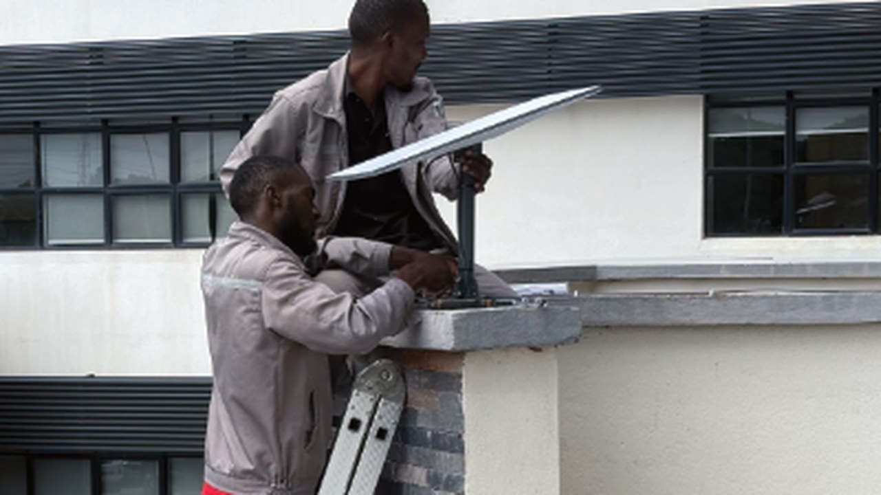 Suburban rooftop Starlink installation
